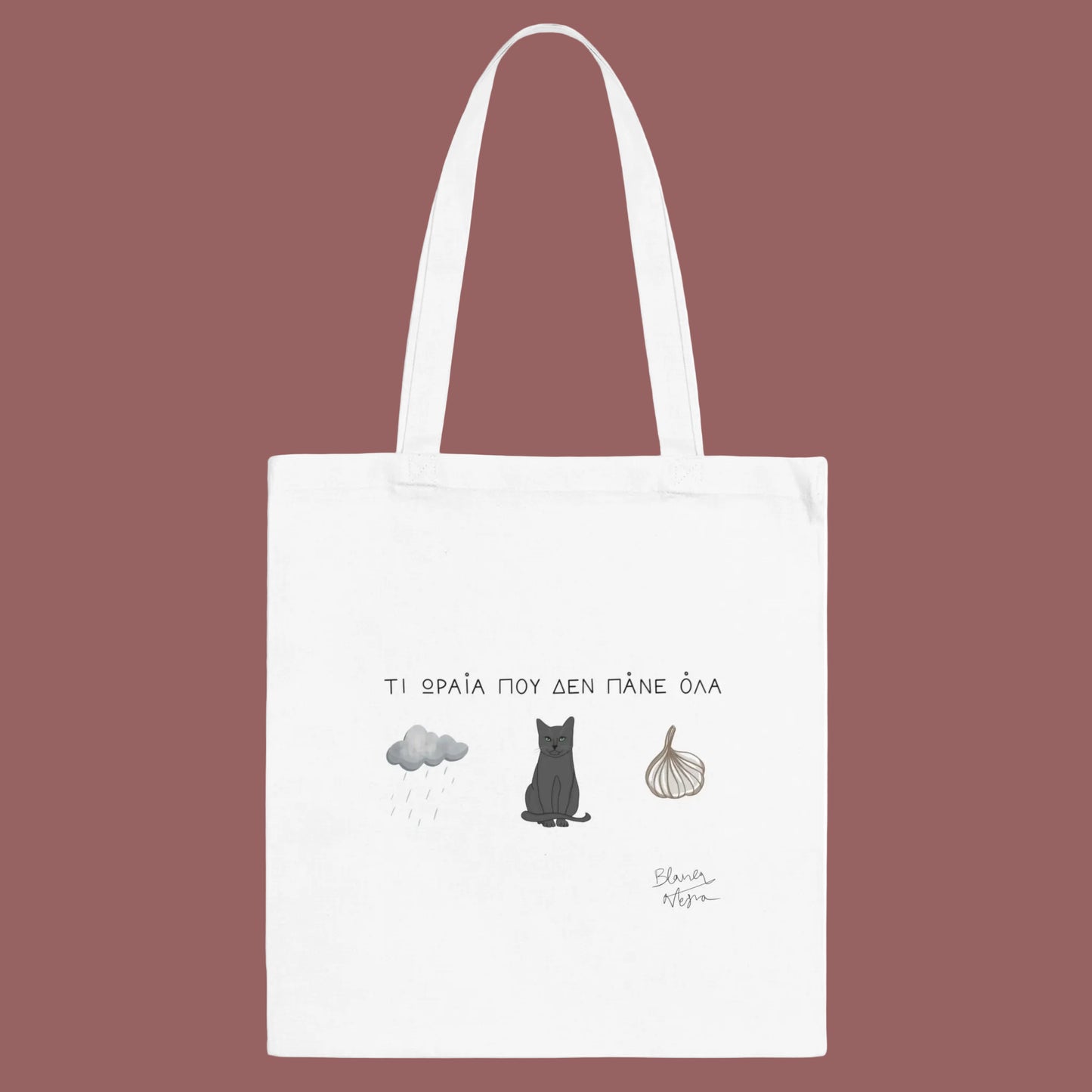 White tote bag with cat illustration and text on a white background