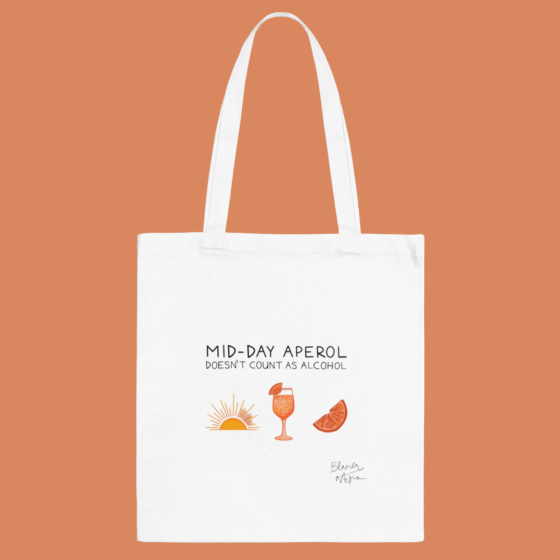 White tote bag with 'Mid-Day Aperol doesn't count as alcohol' text and drink illustrations on a white background