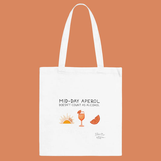 White tote bag with 'Mid-Day Aperol doesn't count as alcohol' text and drink illustrations on a white background