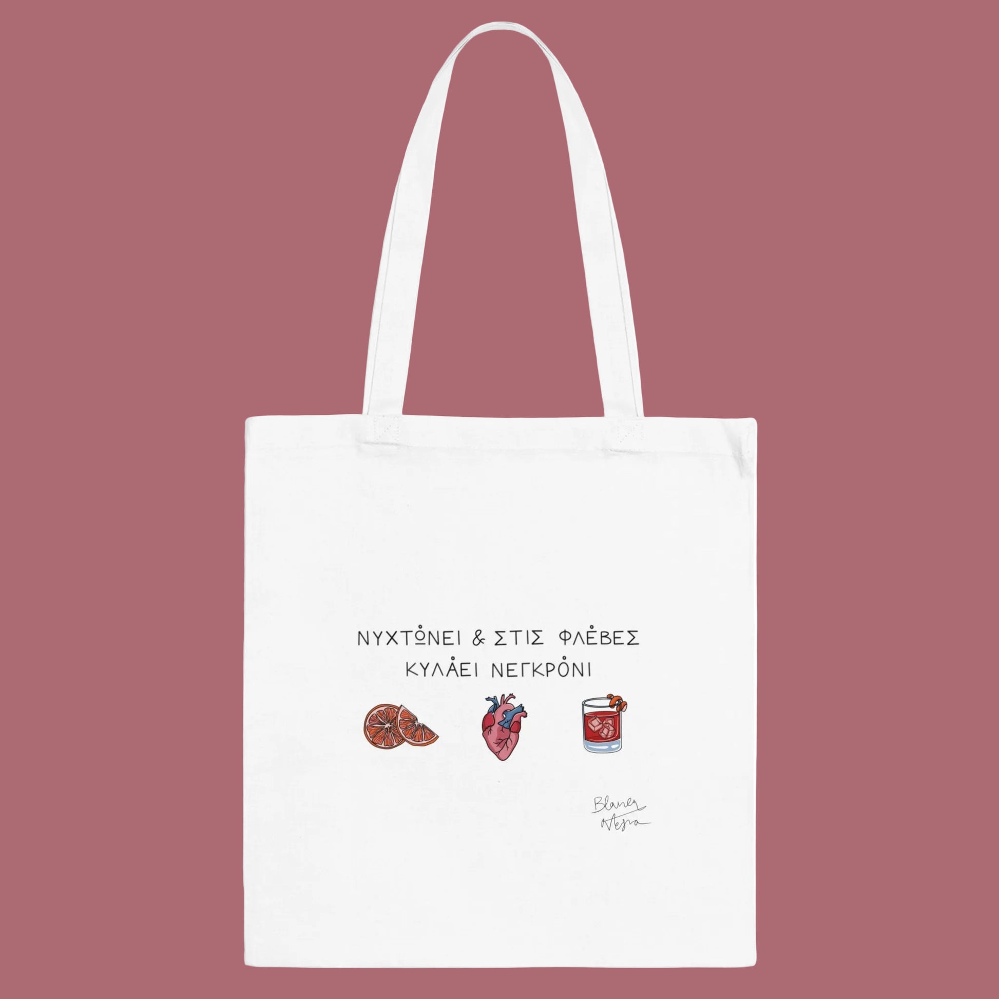 White tote bag with text and illustrations on a white background